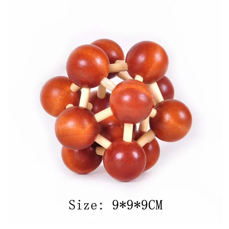 Wooden ball puzzle toy with red spheres and wooden connectors on a white background