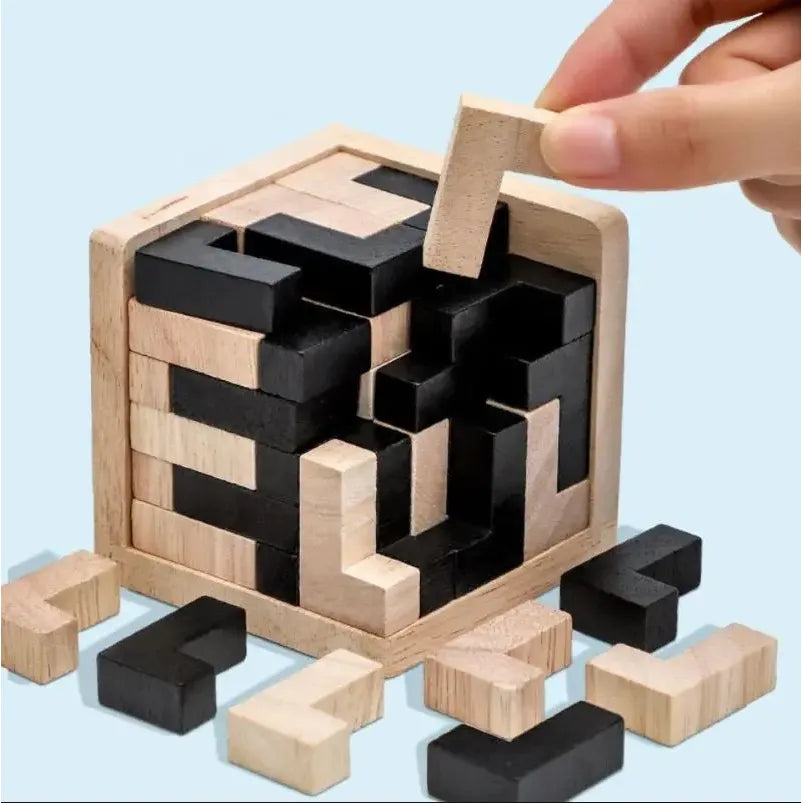 Wooden puzzle with black and natural wood blocks on a light blue background
