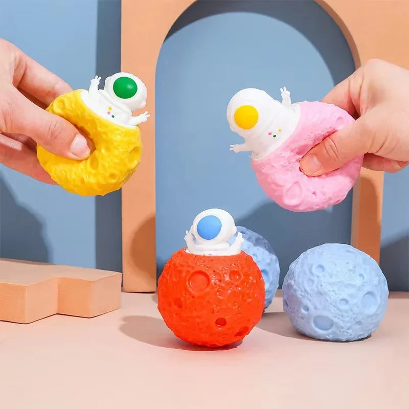 astronaut squeeze toy on colorful planet stress relief