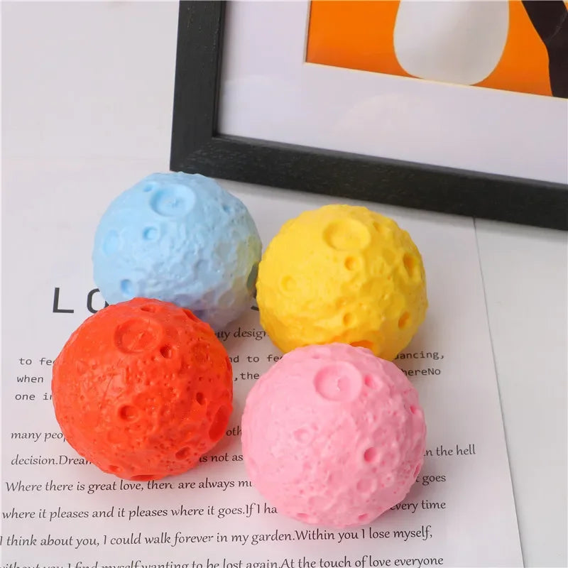 astronaut squeeze toy on colorful planet stress relief