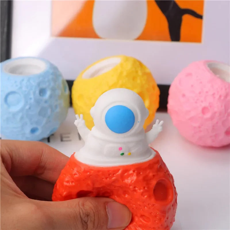 astronaut squeeze toy on colorful planet stress relief