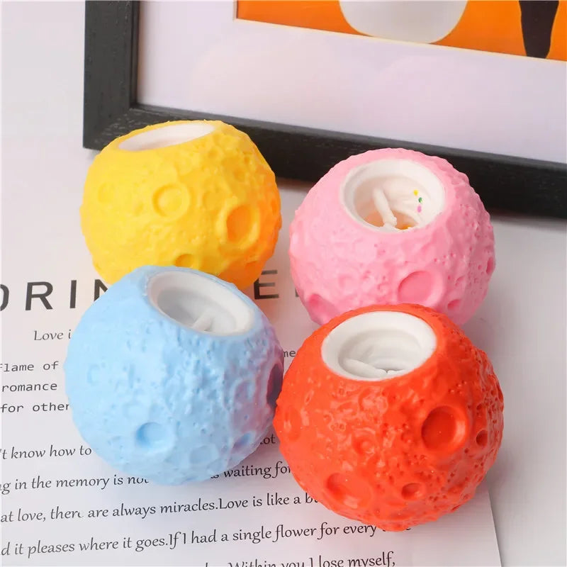 astronaut squeeze toy on colorful planet stress relief