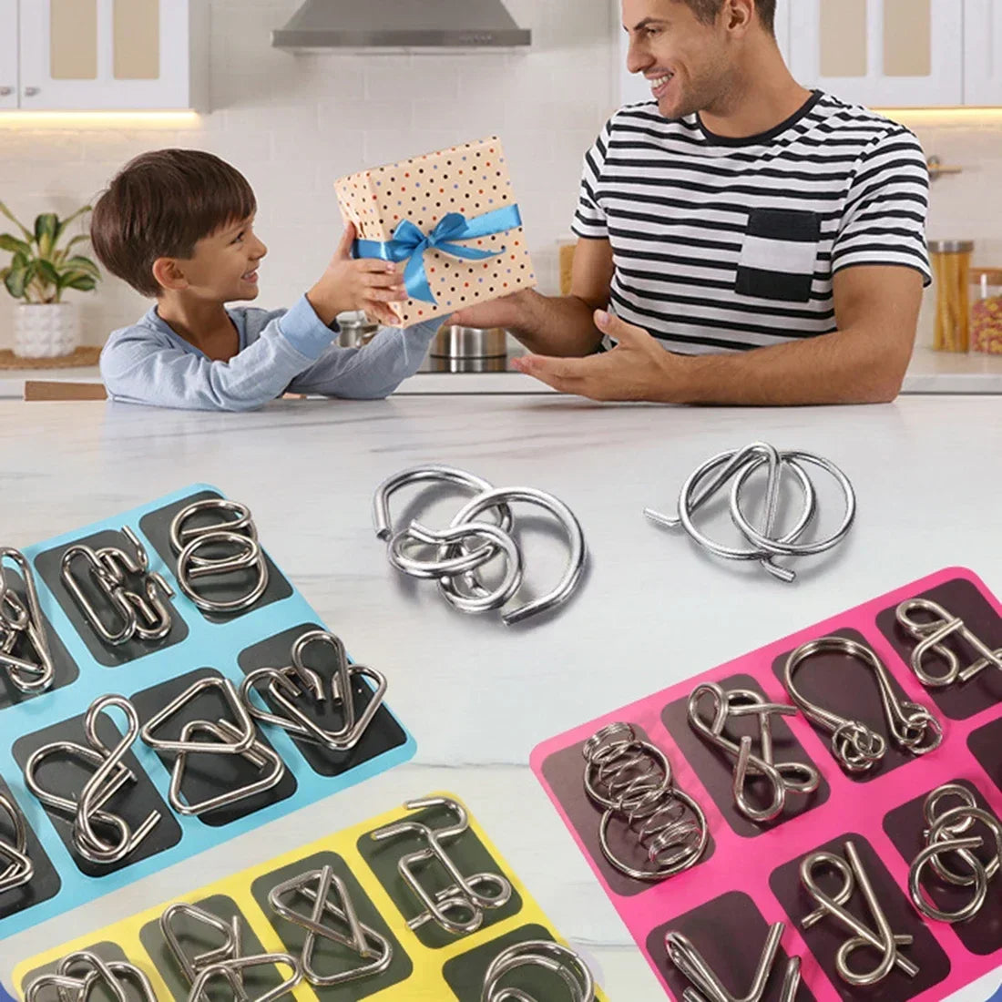 hand holding small metal puzzles for adults